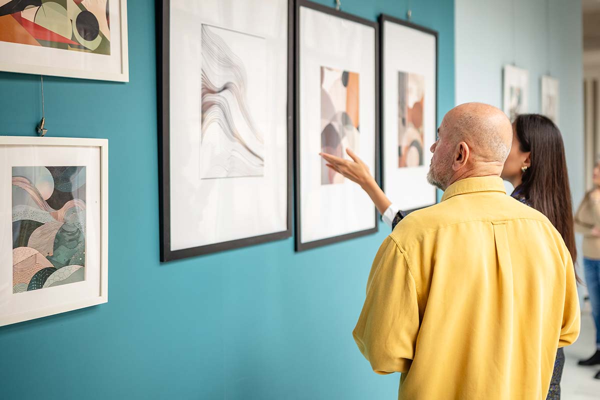 Couple looking at art in art gallery