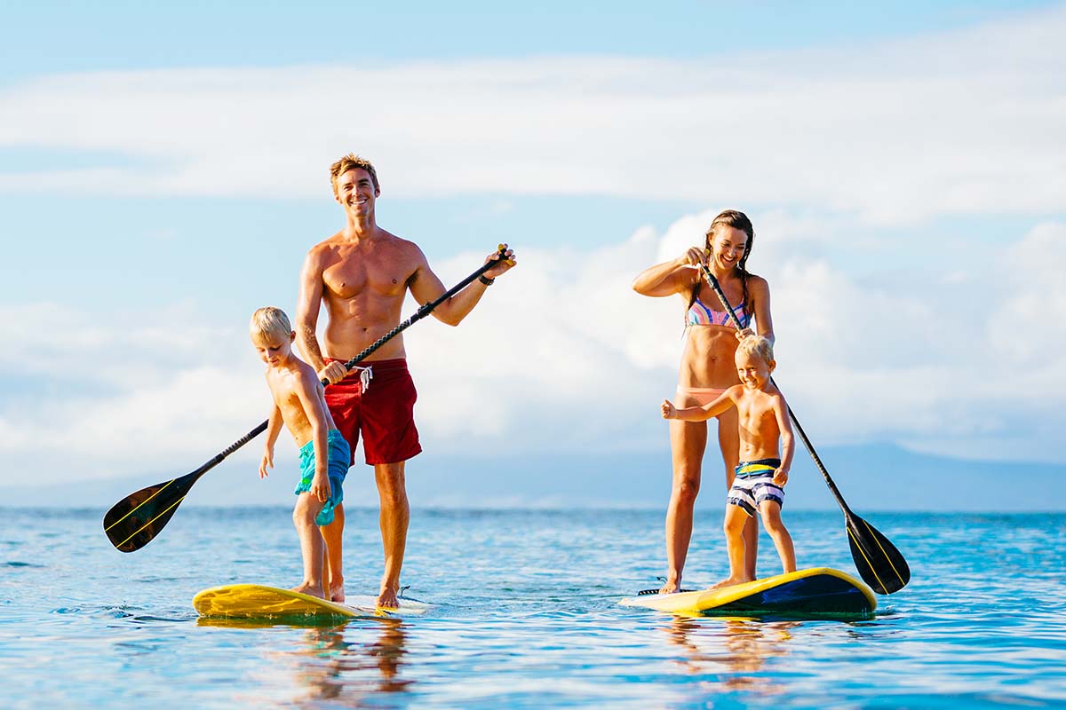 Family paddle boarding with kids
