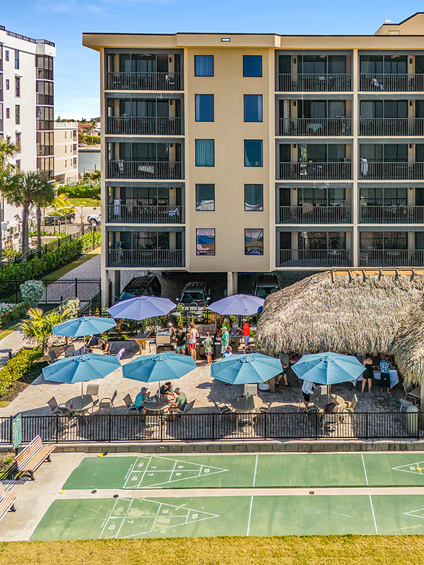Pool deck with umbrellas and shuffle board